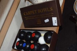 Set of carpet bowls, boxed