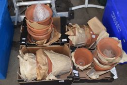 Four boxes of various terracotta plant pots