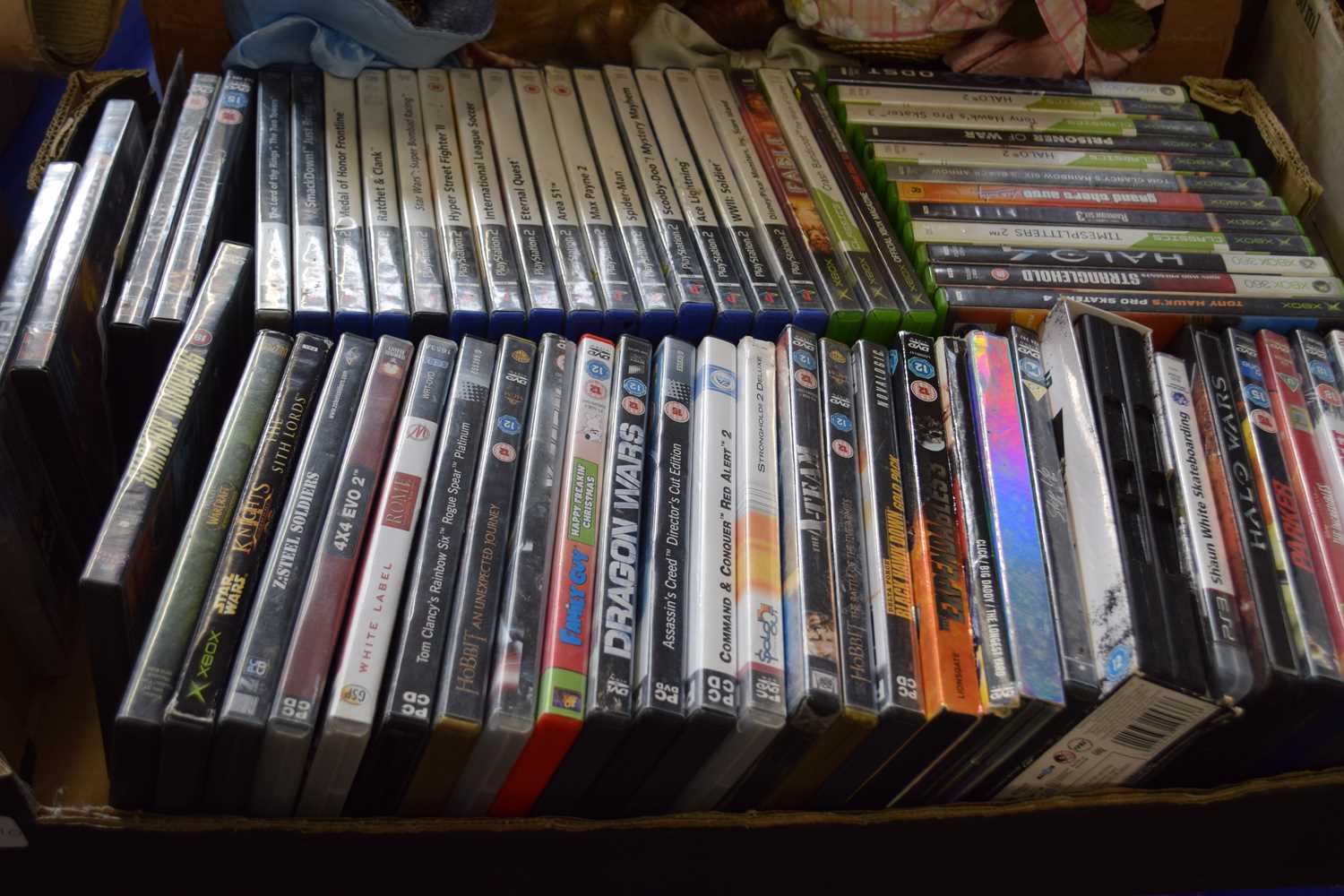 Box of assorted DVD's, Xbox and Playstation games