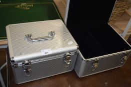 Two small aluminium flight cases (empty)