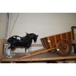 A ceramic shire horse and wooden cart
