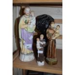Pottery figure of a Saint holding a child together with two others similar and a small bust of a