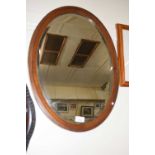 Mahogany framed oval wall mirror