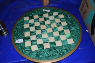 A malachite and a hardstone inlaid chess board
