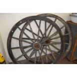 Two large cart wheels