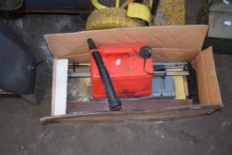 Box containing mitre saw, fuel can etc