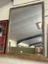 A large modern bevelled wall mirror in distressed finish frame