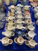 Collection of various pottery shaving mugs