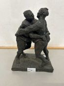 A bronzed composition model of two Sumo wrestlers signed M D Conway