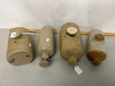 Group of four various stone ware hot water bottles