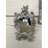 Small continental porcelain framed mirror with floral encrusted detail