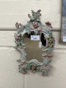 Small continental porcelain framed mirror with floral encrusted detail