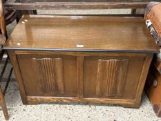 Oak blanket box with carved decoration to the front