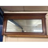 Rectangular wall mirror set in a hardwood frame with fluted decoration