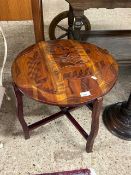 Modern hardwood coffee table with carved figural decoration