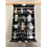 Small wall mounted collectors cabinet containing twelve reproduction Chinese miniature vases