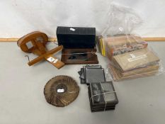 A stereoscope viewer together with a selection of various assorted cards, glass photograph negatives