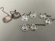 Two modern silver decanter labels together with a set of six Coalport porcelain decanter labels