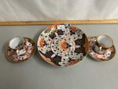 A pair of Spode gilt coffee cans and saucers together with a Crown Derby dish