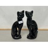 A pair of retro mid Century black glazed cat models