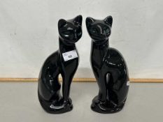 A pair of retro mid Century black glazed cat models