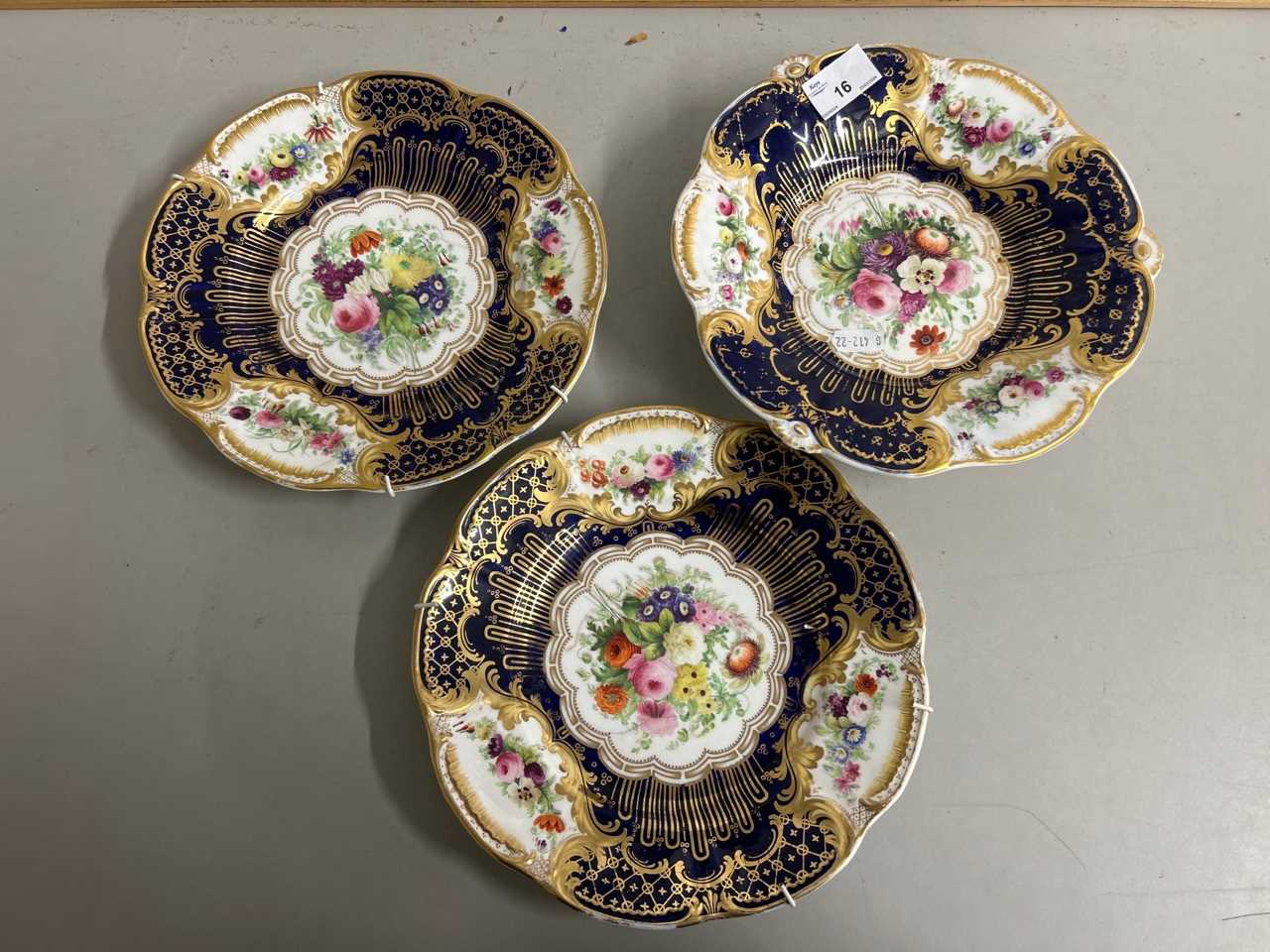 A pair of 19th Century gilt decorated cabinet plates and a further similar comport, all heavily