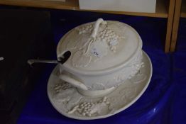 A cream ware soup tureen and dish