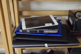 An iPad mini, two Acer Netbooks and a Samsung laptop