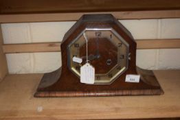An Art Deco oak cased mantel clock