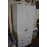 Modern white wardrobe with three drawers below