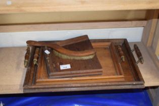 Two wooden trays and a table brush and scoop