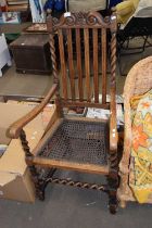 A cane seated elbow chair