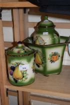 A Mayfayre fruit decorated storage jar, urn and planter