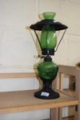 A green glass oil lamp