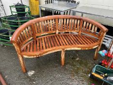 Modern hardwood banana type bench (damaged)