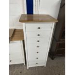 Modern narrow oak and cream finish seven drawer bedroom chest, 58cm wide