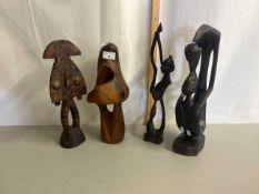 Group of four various carved African figures