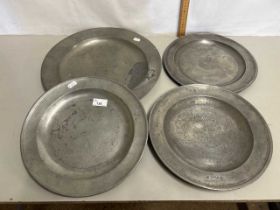 Group of four circular pewter dishes
