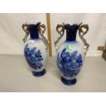 Pair of early 20th Century blue and white decorated vases