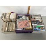 Four boxes of various postcards