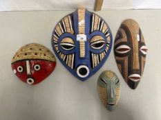 Group of four Congolese pottery masks, circa 1980's