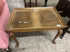 A walnut veneered cabriole legged coffee table