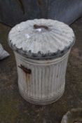 A galvanised dustbin