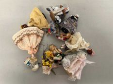 Collection of small costume dolls