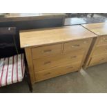 Modern light wood four drawer chest with metal handles, 98cm wide