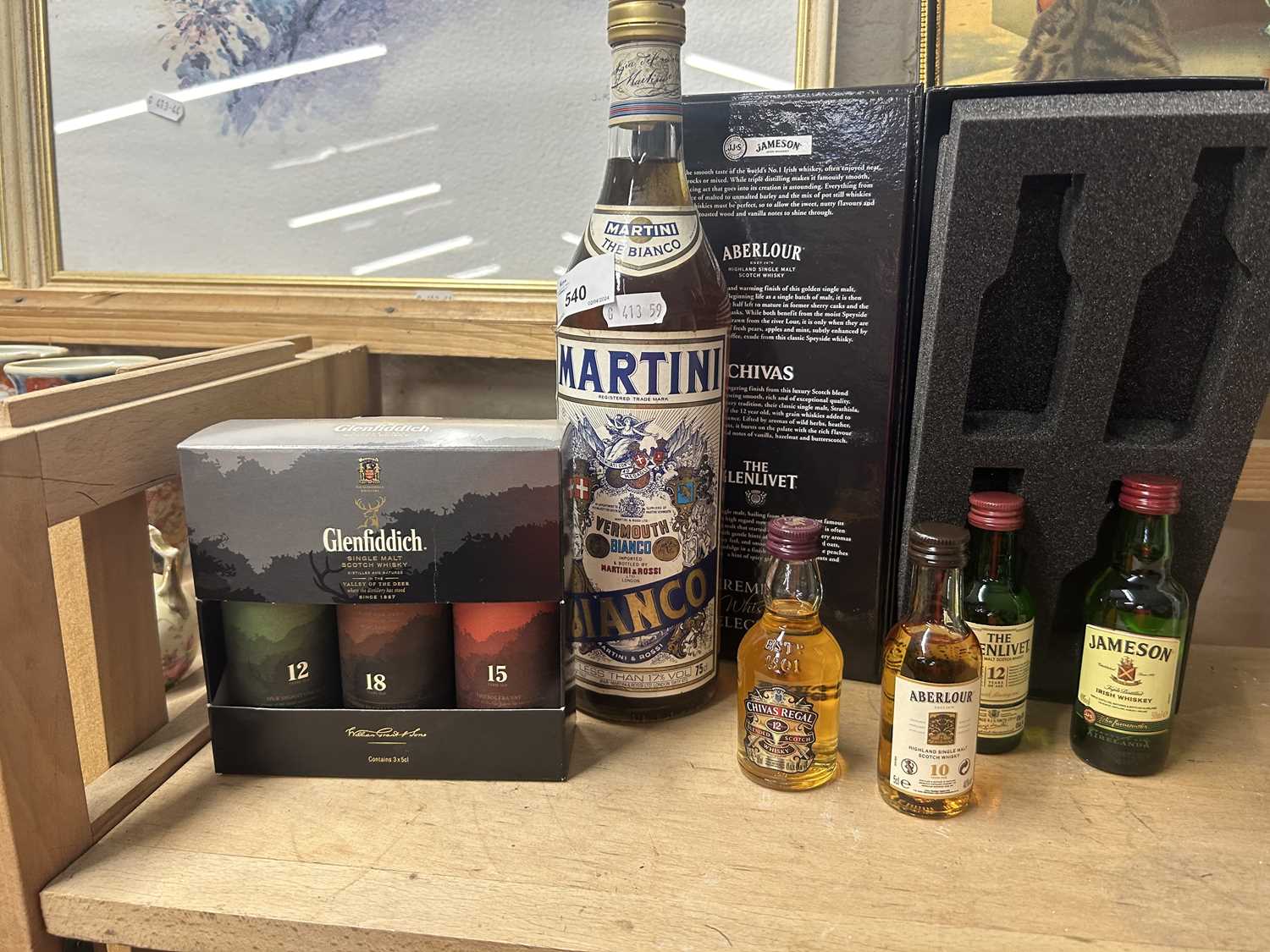 Mixed Lot: Boxed miniature whisky bottles together with a bottle of Martini