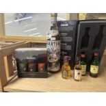 Mixed Lot: Boxed miniature whisky bottles together with a bottle of Martini