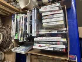 Box of various Xbox and Nintento Wii and other computer games