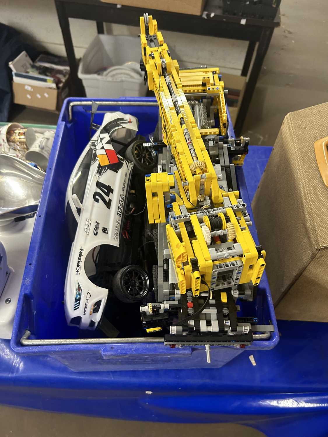 Box of various toy vehicles to include a Lego Technic crane