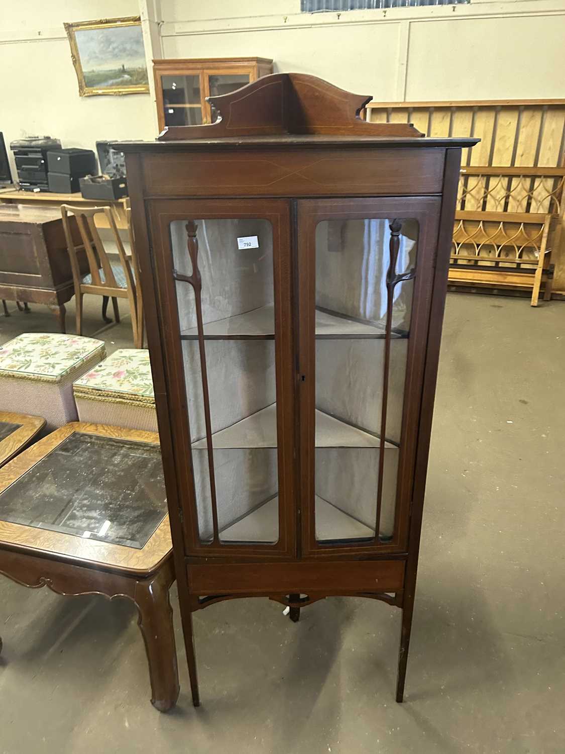 An Edwardian corner display cabinet